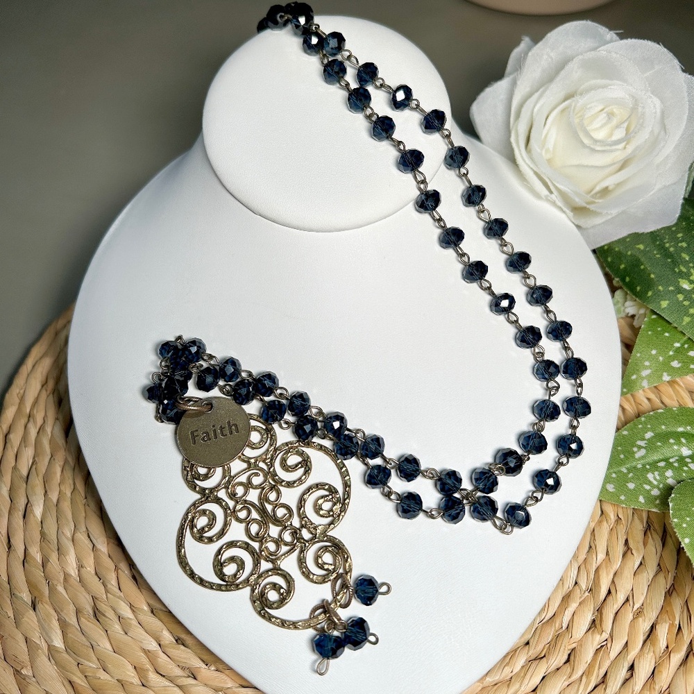 Mac and Me long necklace features a beautiful filigreed hammered brass pendant